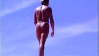 Tanned guy on beach in tiny string thong (temporarily!) - nvdvid.com