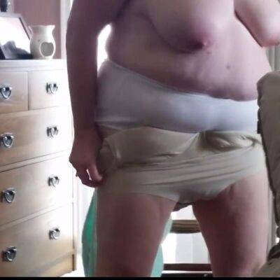 Putting on creame, girdle, clothes over her big tits - sunporno.com