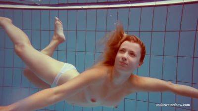 In The Indoor Pool, A Stunning Girl Swims - upornia.com
