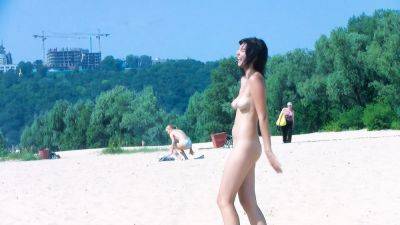 Hot nudist teen filmed by voyeur as she sits naked outside - hclips.com