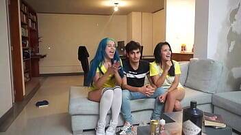 man watches a soccer game with two girls licking pussy next to him - xvideos.com - Colombia